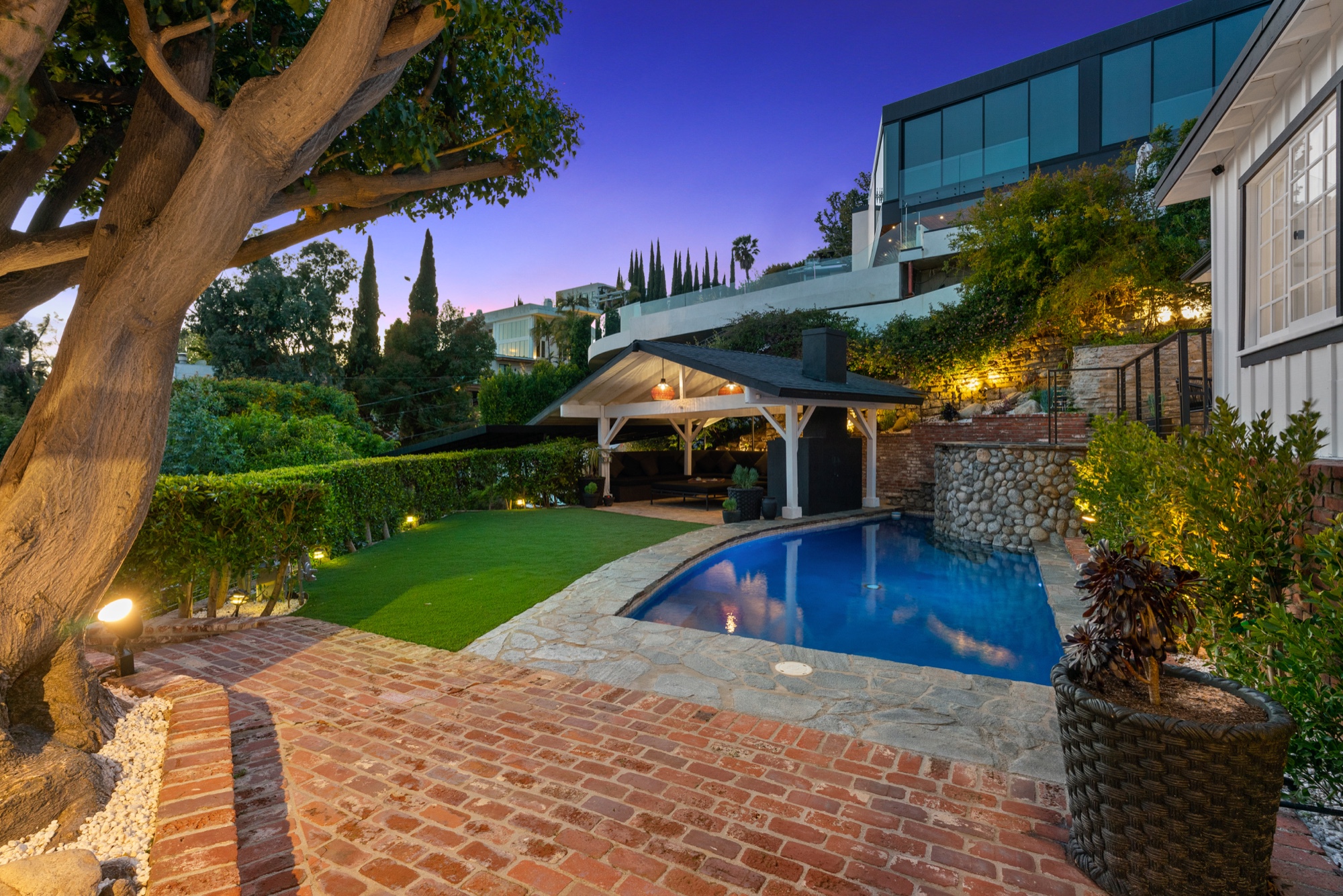 Modern home exterior at twilight representing real estate excellence